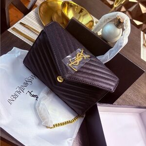 Yves Saint Laurent Black Quilted Clutch with Gold Accents